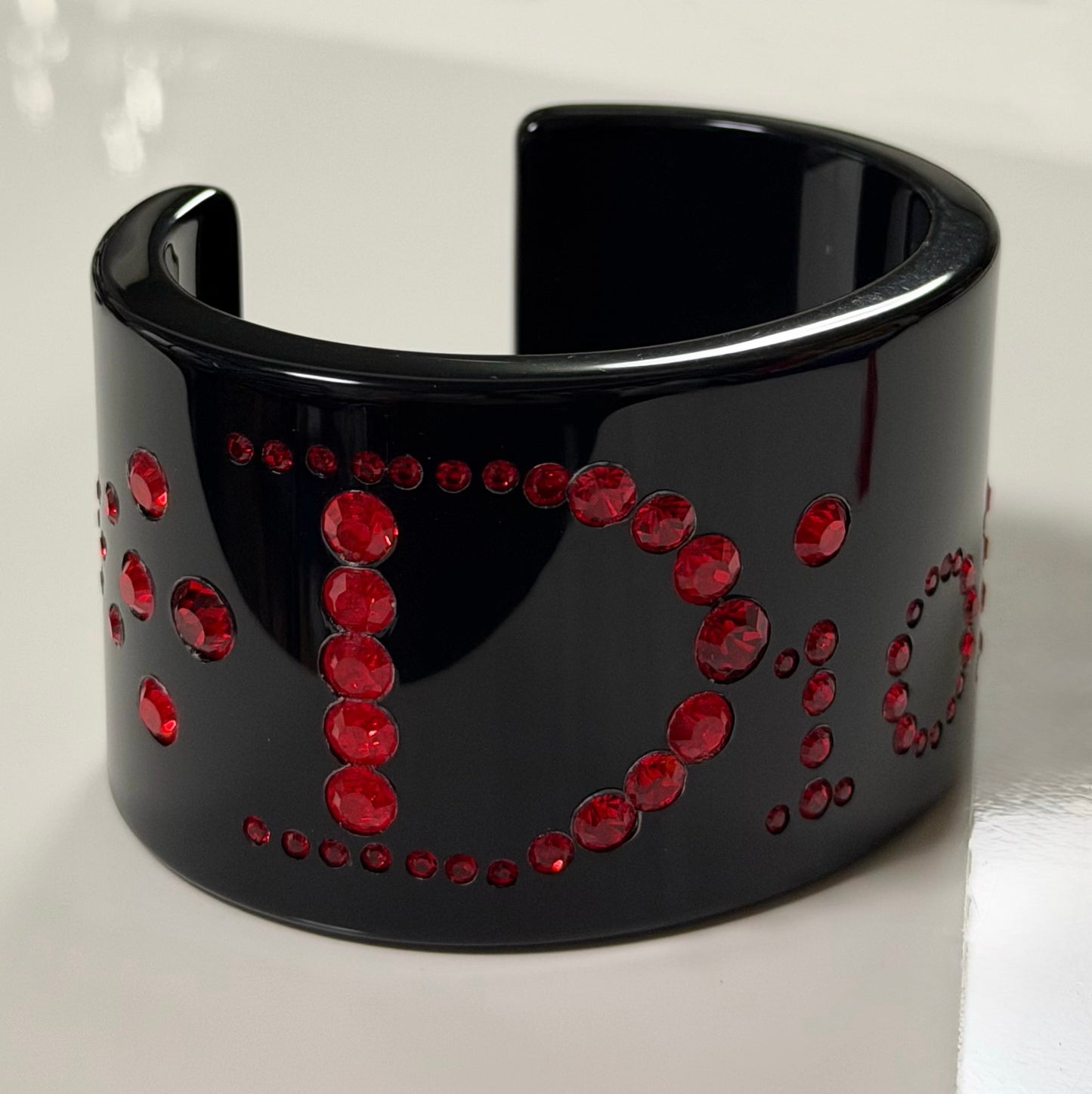 CHRISTIAN DIOR 2004 Black Lucite Cuff Bracelet with Red Rhinestones