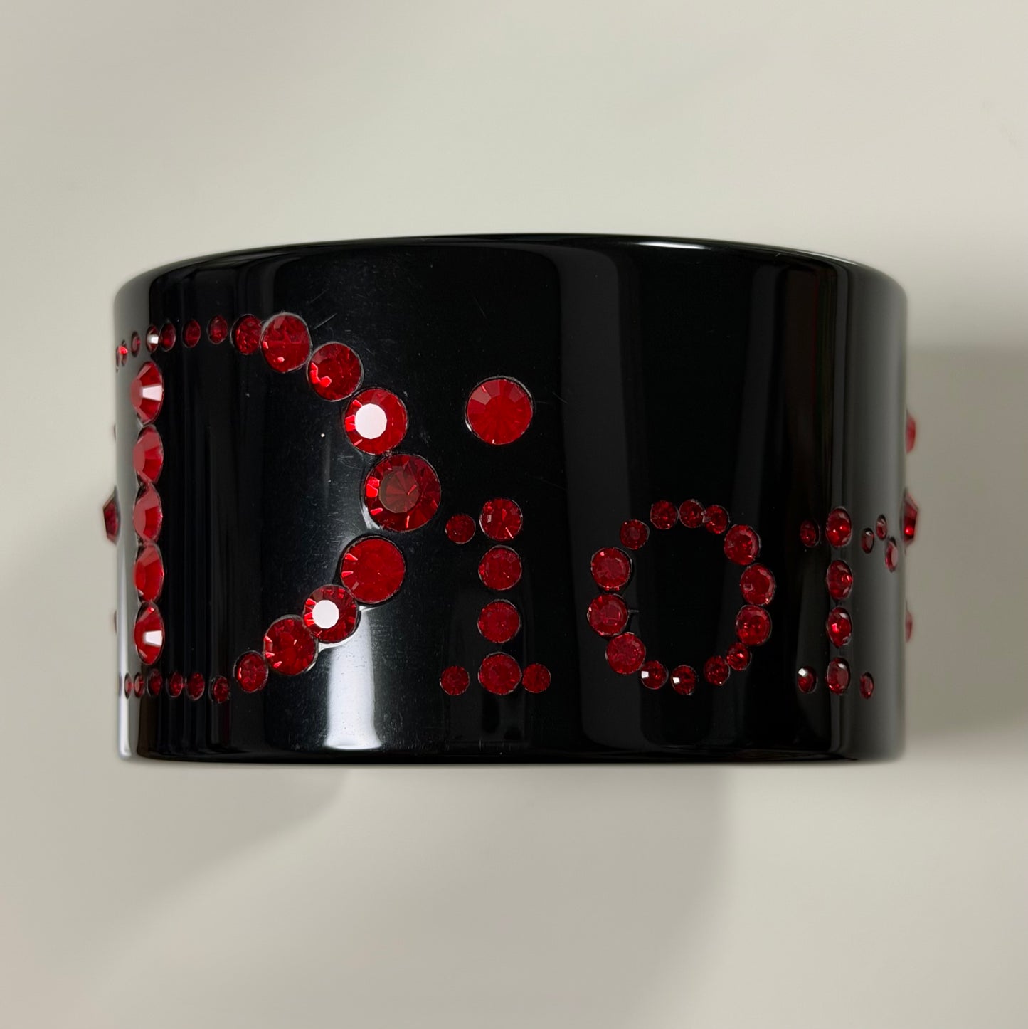 CHRISTIAN DIOR 2004 Black Lucite Cuff Bracelet with Red Rhinestones